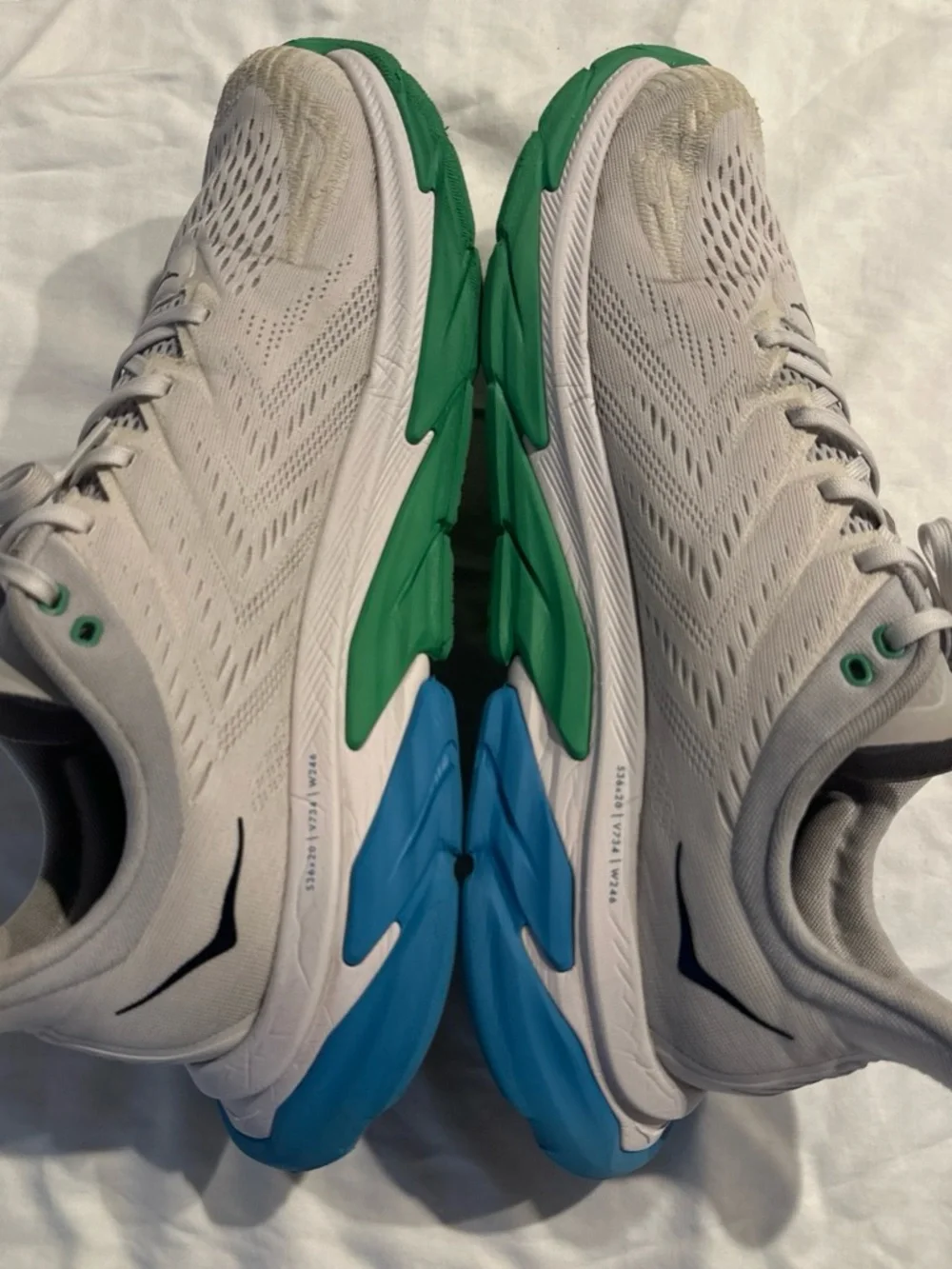 Hoka Men's White Running Shoes with Green and Blue Soles